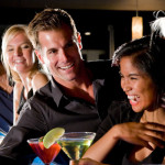 group-of-people-with-drinks-at-nightclub-bar